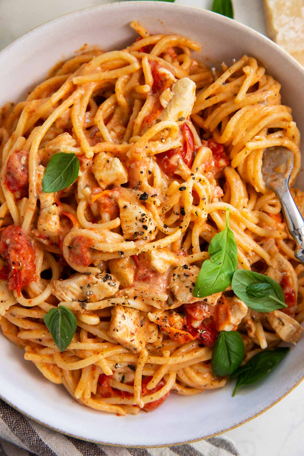Bowl with tomato basil chicken pasta.