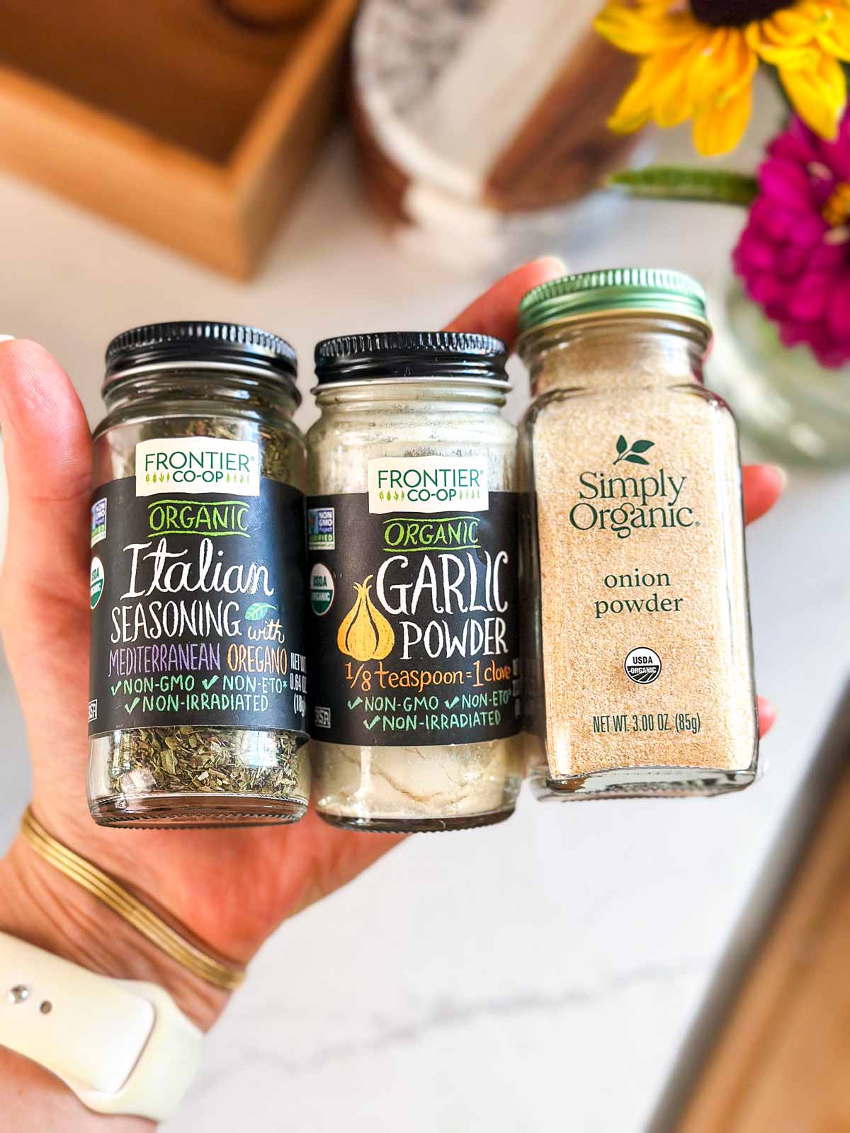 Female hand holding spices.