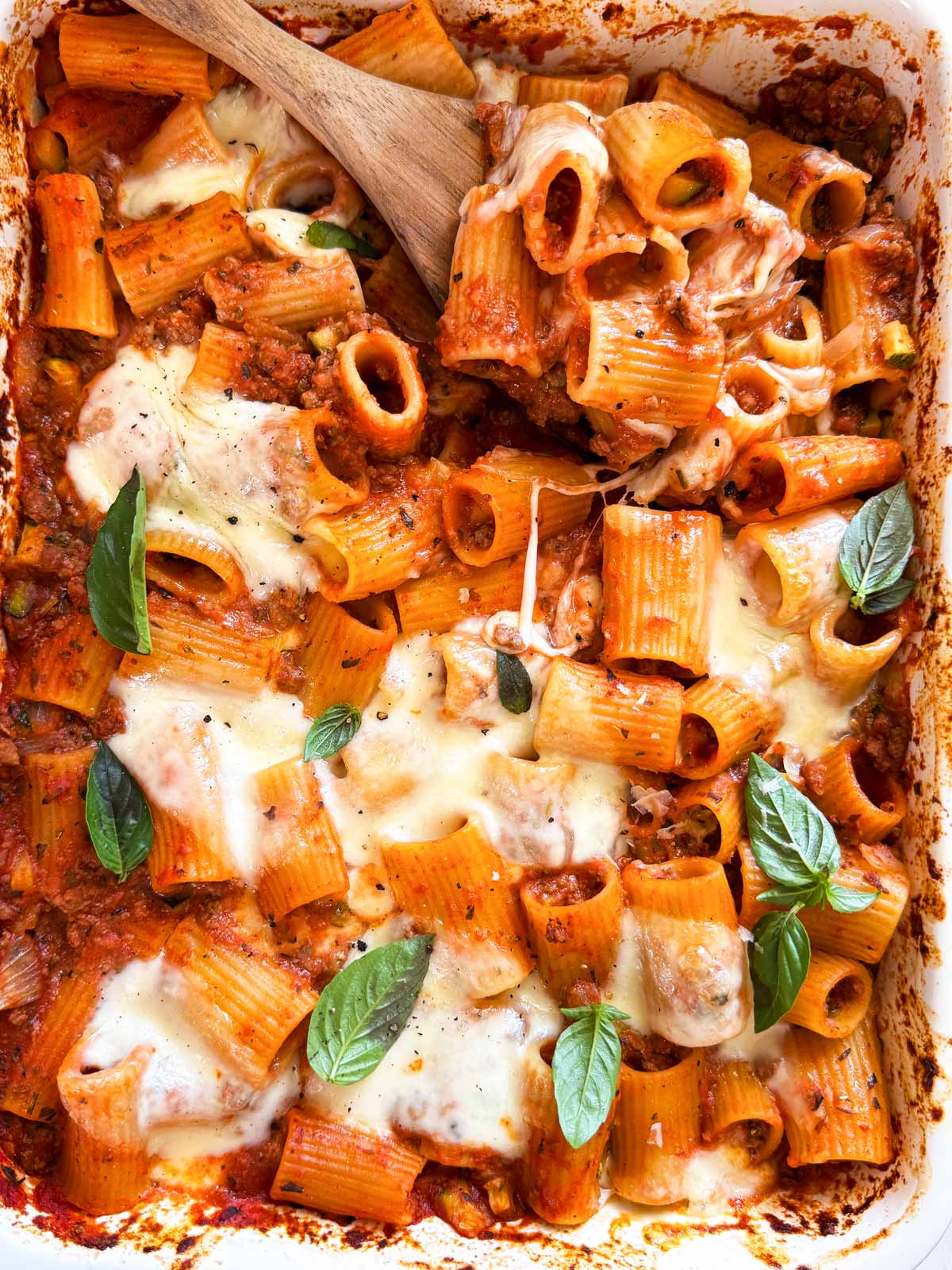 Close up photo of ground beef and pasta casserole with zucchini.