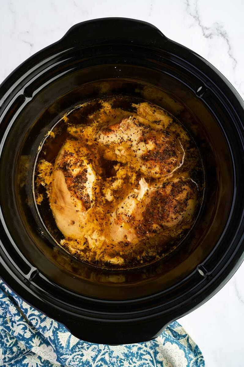 Cooked chicken breast in a crockpot.