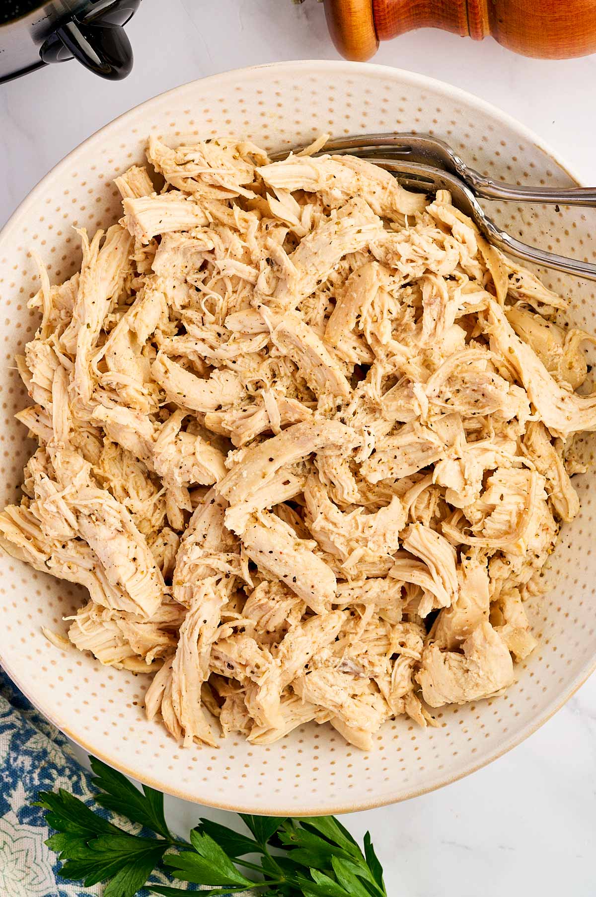 Bowl with shredded chicken.