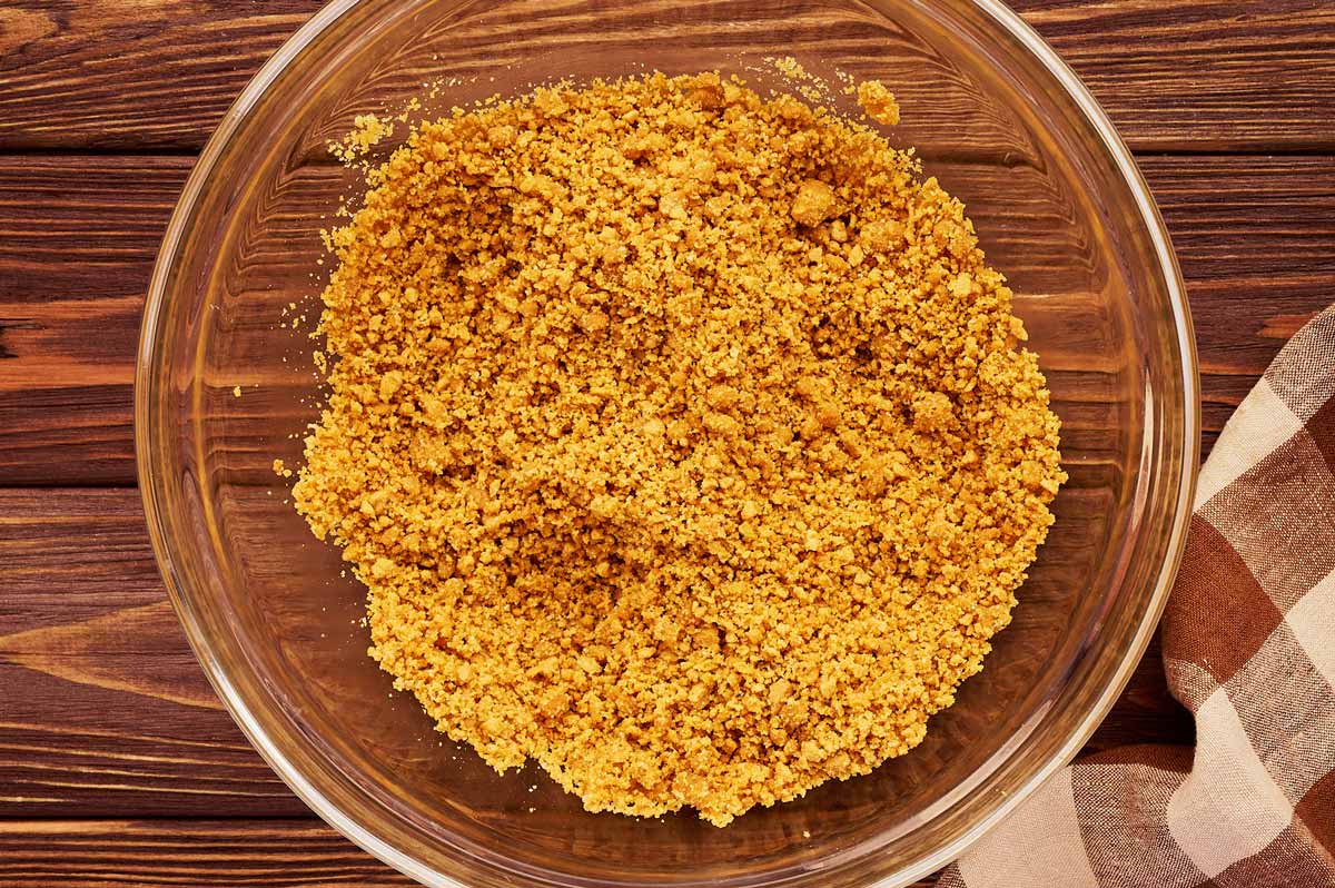 No bake cheesecake crust mixture in a glass bowl.