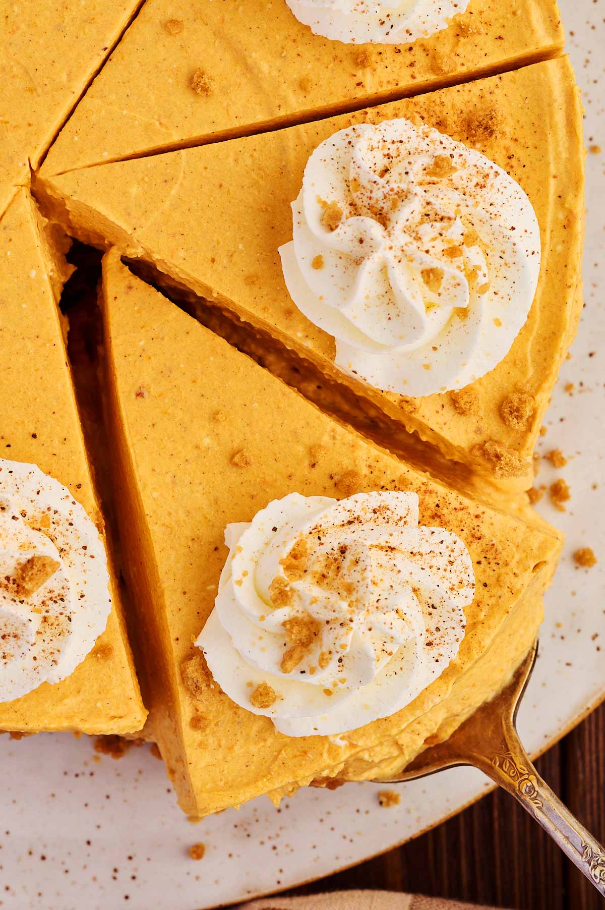 Overhead view of a slice of no bake pumpkin cheesecake.