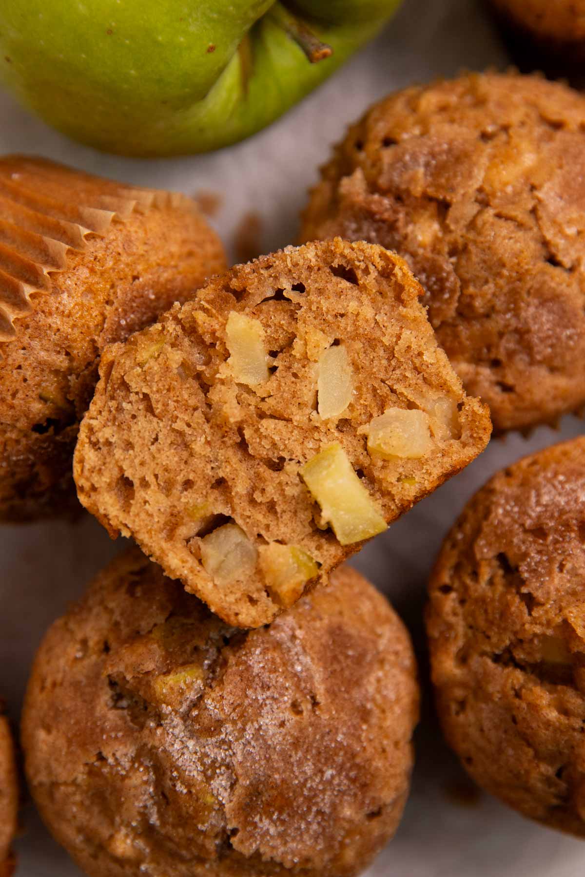 Overhead view of a halved apple muffin.