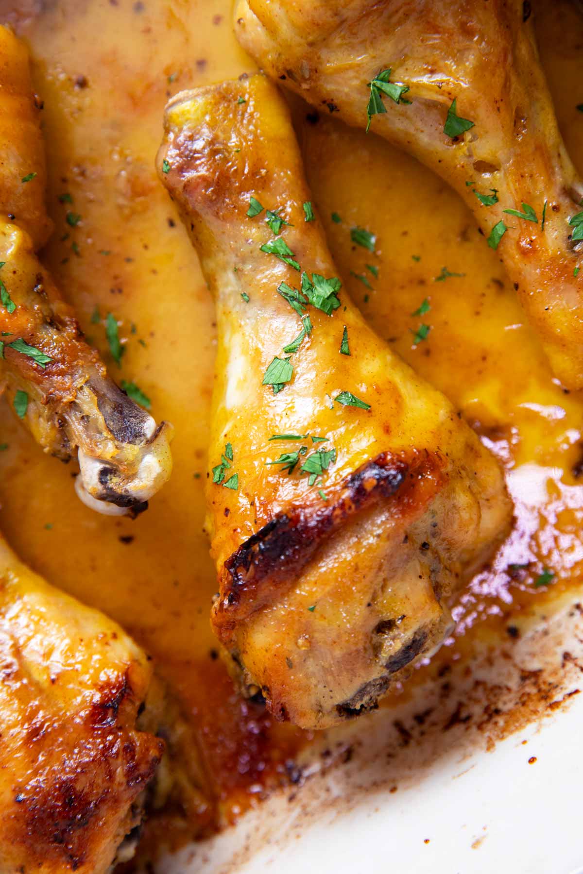 Close up photo of a baked chicken leg.