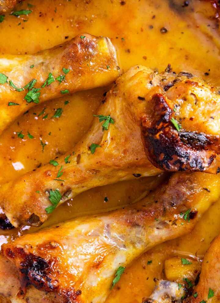 Close up photo of oven baked chicken leg.