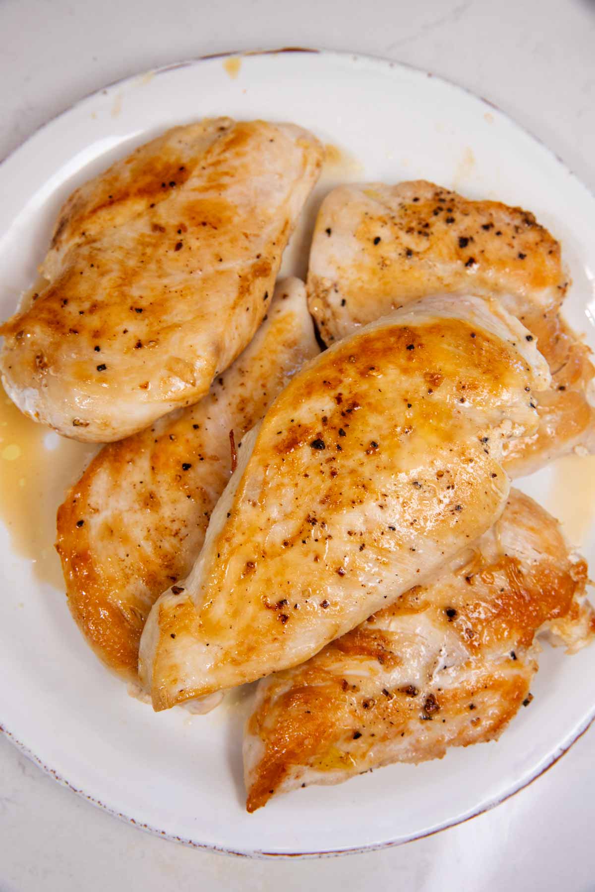Seared chicken on a plate.