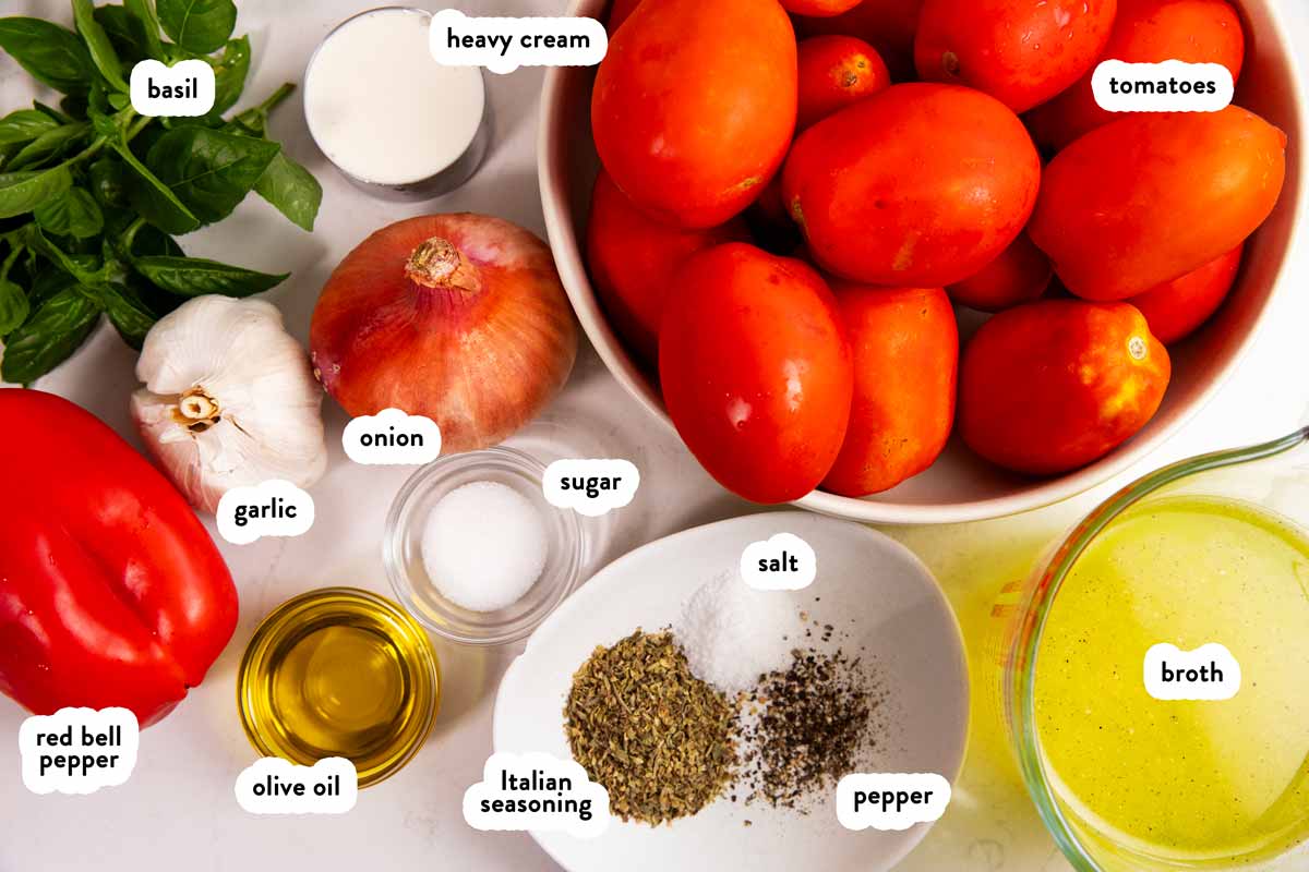 Ingredients for tomato soup with text labels.