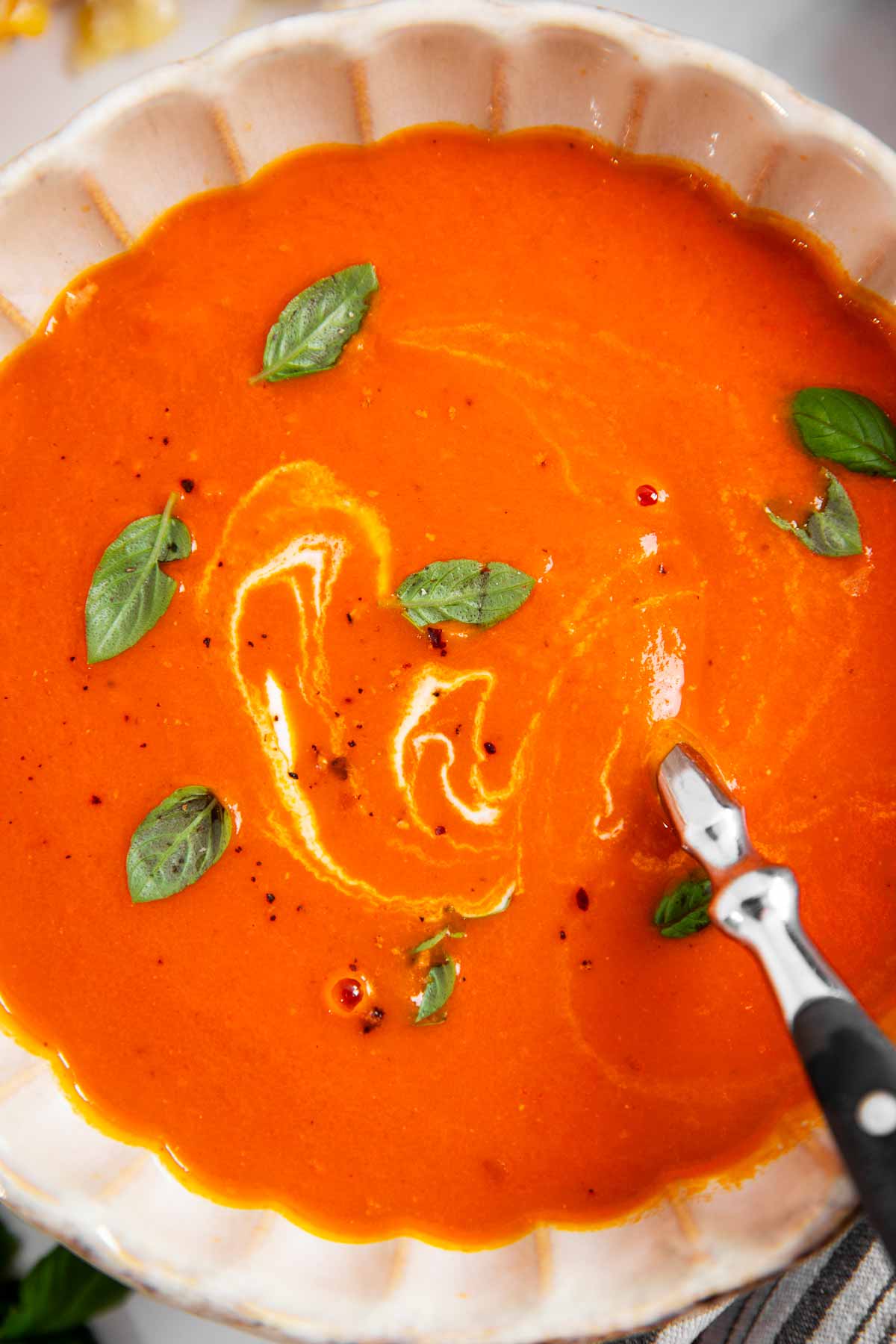 Overhead view of a bowl of tomato soup.