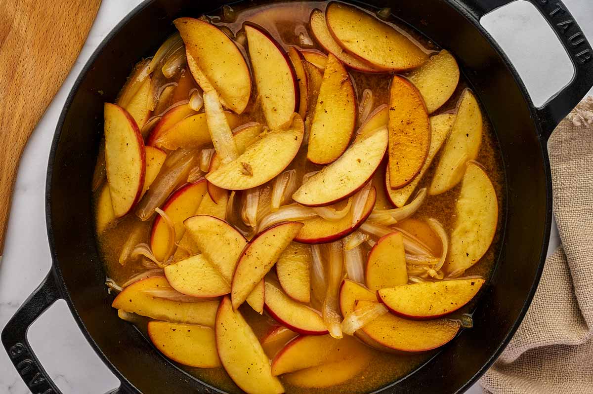 Sautéed apples in a cast iron skillet.