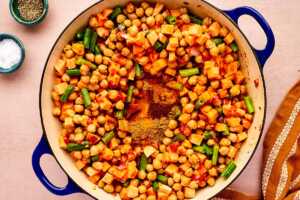 Diced vegetables in a braiser.