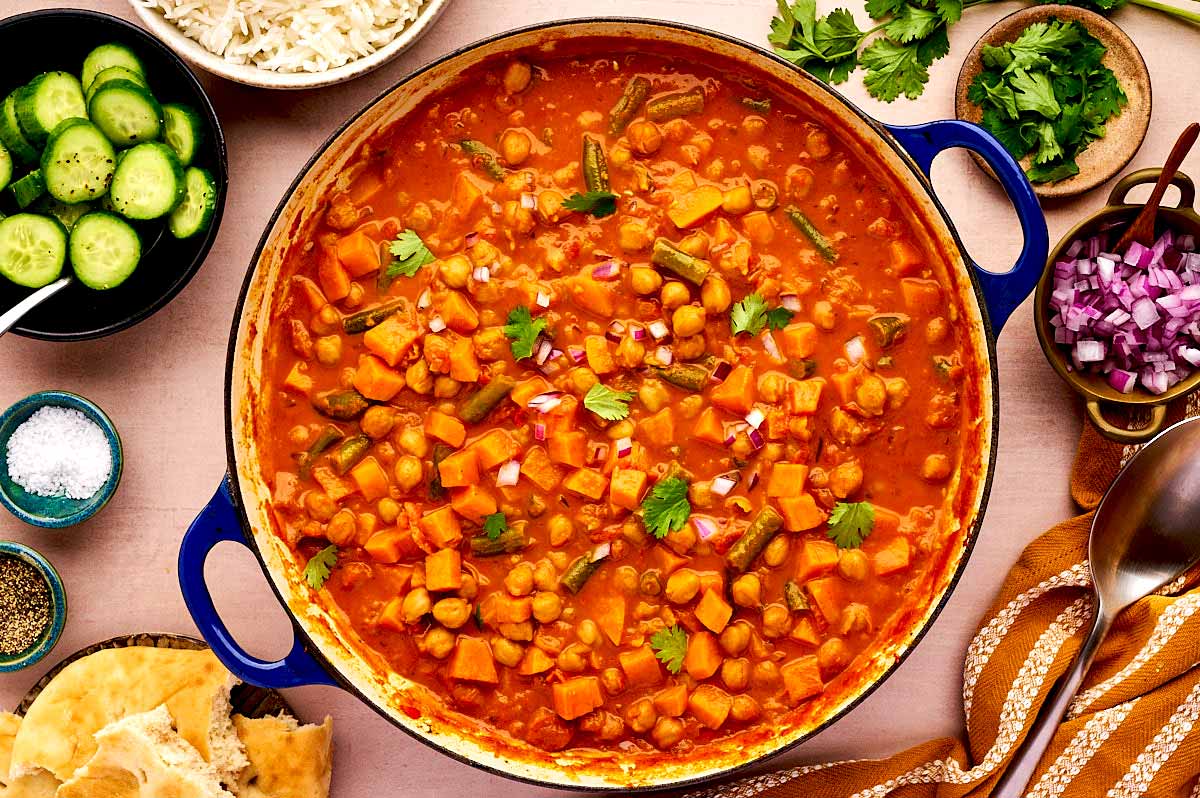 Overhead view of sweet potato chickpea curry being served.