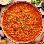 Overhead view of sweet potato chickpea curry being served.