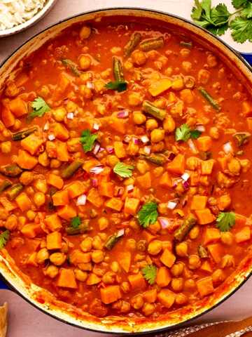 Overhead view of sweet potato chickpea curry being served.